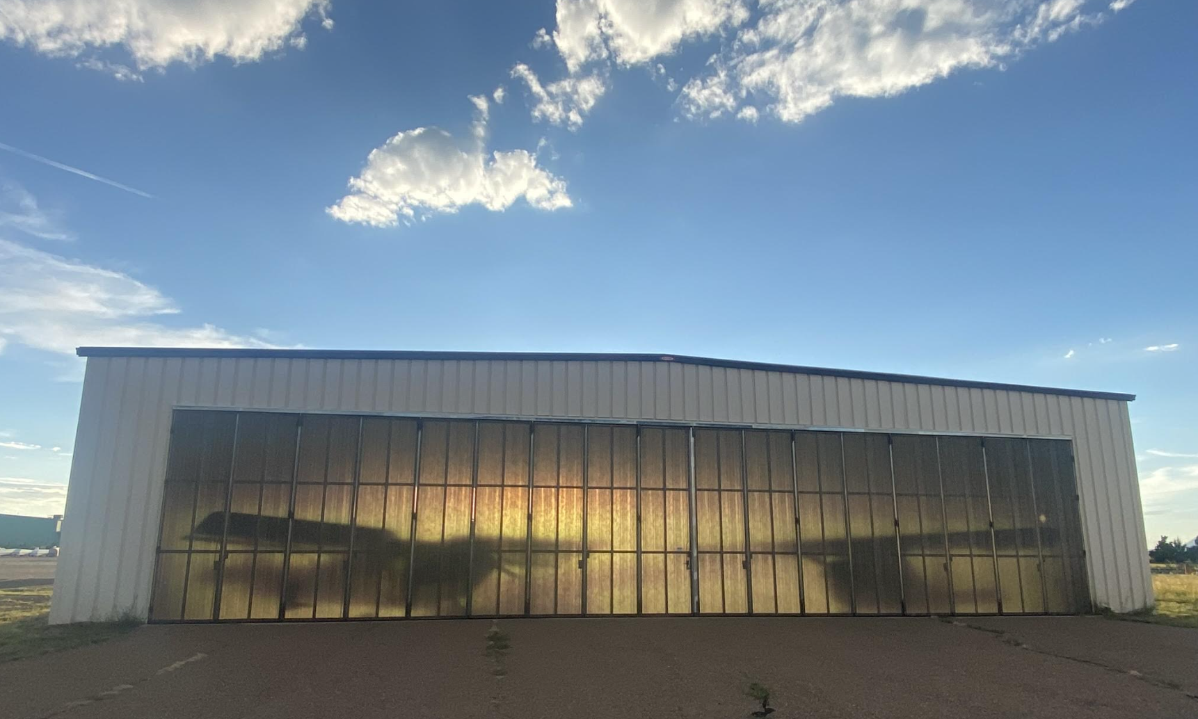 Hangar backlit by sunlight